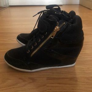 Black Wedge high top sneakers.